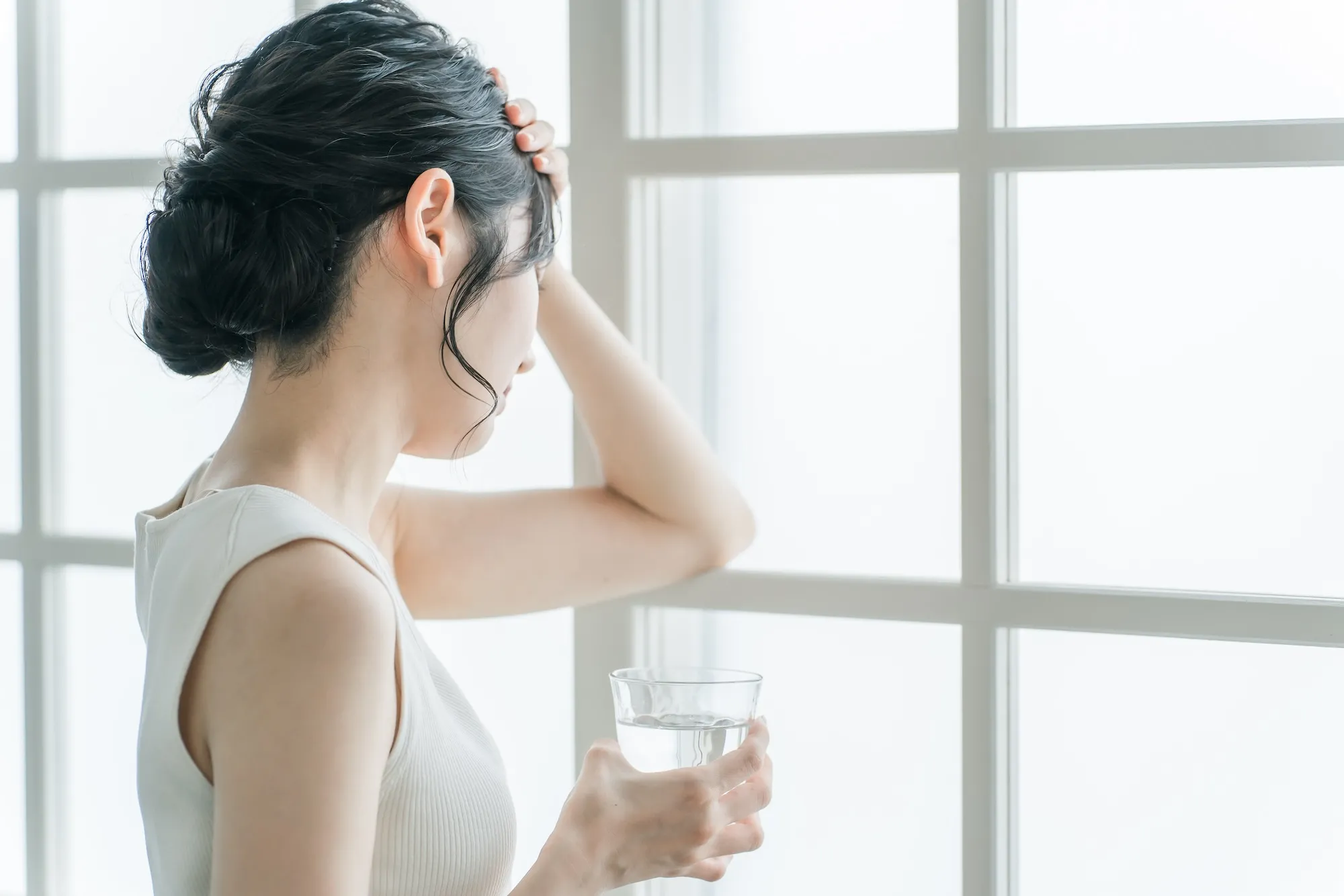 体調不良に悩む女性