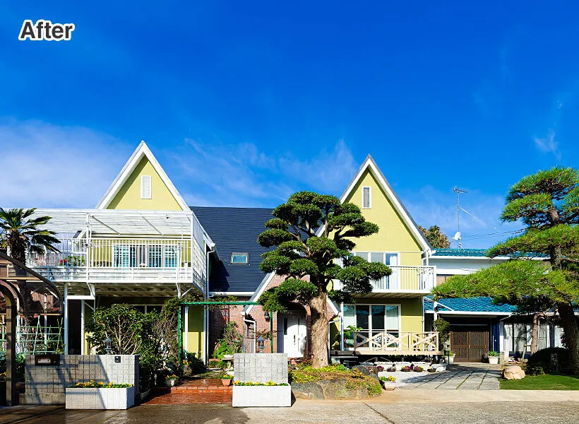 鮮やかなライトグリーンが印象的なシンメトリーの住宅外観